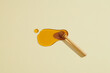 © Marc Tran/Stocksy - Honey with honey dipper isolated on light yellow background