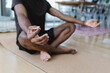 © Tanya Yatsenko/Stocksy - Man doing meditation at home.