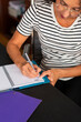 © Lightsy/Stocksy - Woman taking notes