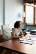 © Lightsy/Stocksy - Portrait of a brunette businesswoman