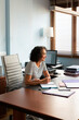 © Lightsy/Stocksy - Businesswoman portrait in the office