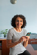 © Lightsy/Stocksy - Portrait of a smiley businesswoman with a phone