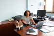 © Lightsy/Stocksy - Smiley woman working in a laptop