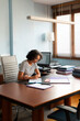 © Lightsy/Stocksy - Lawyer working with documents