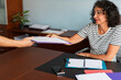 © Lightsy/Stocksy - Lawyer receiving files