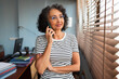 © Lightsy/Stocksy - Woman on the phone with a client