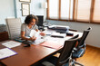 © Lightsy/Stocksy - Woman working in an office