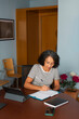 © Lightsy/Stocksy - Woman taking notes on the agenda