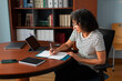 © Lightsy/Stocksy - Woman working in an office