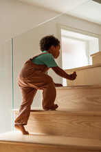 Toddler Going Up The Stairs At Home 