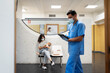 © Santi Nuñez/Stocksy - mother breastfeeding baby in doctor's waiting room