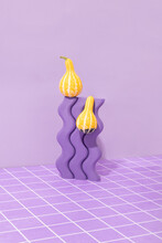 Yellow Ornamental Gourds With Wavy Object And Purple Tiles.