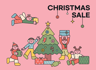 Wall Mural - spring sale. cute children decorating the christmas tree and children opening gift boxes around them