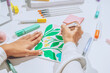 © AUDSHULE/Stocksy - Hands drawing colourful sketch.