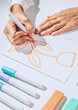 © AUDSHULE/Stocksy - Illustrator drawing flower