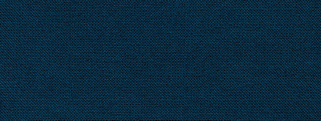 Texture of navy blue color background from textile material with wicker pattern. Structure of vintage fabric