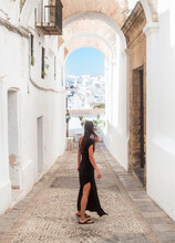 Woman Standing At Picturesque Old Town Street