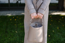 Woman Holding A Leather Bag