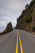 Beautiful Rugged Oregon Coastline With Winding Road Yellow Line 