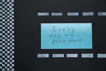 Wall Mural - Card with phrase Every Day Is A Fresh Start on black background, top view. Motivational quote
