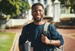 © Allistair F/peopleimages.com - Education, campus and university portrait of student with books, backpack and ready for study, school or learning. Knowledge commitment, scholarship and studying black man happy at college building
