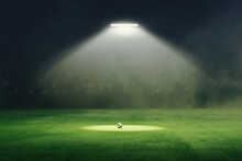 Soccer Ball In The Middle Of The Illuminated Field