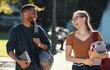 © Allistair F/peopleimages.com - Education, diversity friends and students walking to college lecture class, school campus and talking on fun journey. University study, communication and learning black man and woman happy on travel
