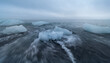 © Elena Saurius & Dani Rex/Stocksy - Block of ice being hit by a wave at Jökulsárlón beach, Iceland.