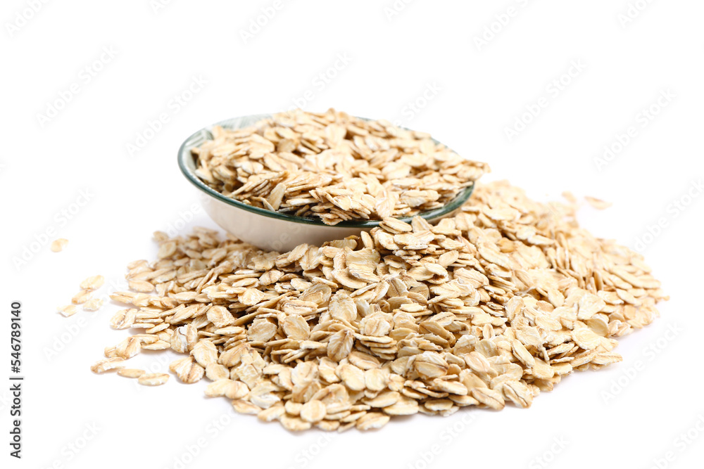 Bowl full of raw oatmeal on white background