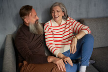 Aged Couple Talking On Sofa