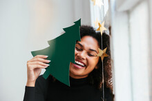 Woman With Paper Spruce Laughing