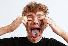Young Man With Christmas Stickers Covering Eyes