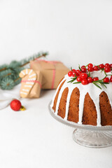 Wall Mural - Dessert stand with traditional Christmas cake on light background