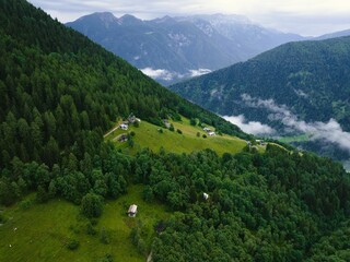 Poster - Scenery of green woody mountain slopes on a cloudy day