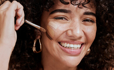 Wall Mural - face, makeup and brush with a woman black model applying foundation to her skin in studio for cosmet