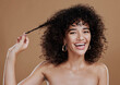 © J Maas/peopleimages.com - Hair care, growth and woman excited about health, wellness and clean shampoo against a brown studio background. Salon, smile and portrait of a model with hair beauty and shine from hairdresser