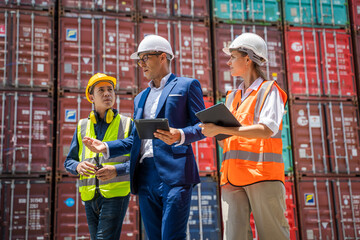 Poster - Businessman and engineer or Foreman checking the container to prepare the delivery to the customer.