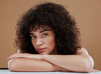 Wall Mural - face, beauty and skincare with a model black woman in studio on a brown background for natural hairc