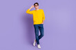 © Tetiana - Full length photo of optimistic imposing guy touch hands eyewear looking isolated shine color background