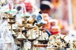 Closeup shot of copper objects and tools for sale in a local market in India with blur background