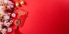 Chinese New Year Decorations Made From Red Packet, Orange And Gold Ingots Or Golden Lump On A Red Background. Chinese Characters FU In The Article Refer To Fortune Good Luck, Wealth, Money Flow.