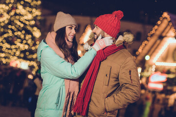 Poster - Photo of cute millennial lovers hug look wear cap jacket scarf gloves near tree outside outdoor