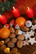 Shot of red lighted Christmas candles and Santa Claus chocolate candy for the holidays