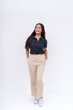 © Mdv Edwards - A lovely Filipina intern in a black polo shirt and khaki pants. Isolated on a white background, full body photo.