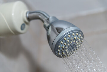 abundant water coming out of the shower, bath