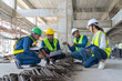 © PINA - team of civil engineer manager, maintenance supervisor, professional technician foreman together with safety operator inspect and discuss the infrastructure of building construction progress at site