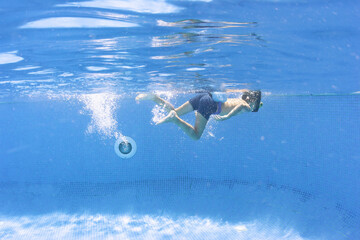 boy swimming in pool