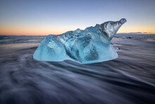 Blue Ice Fragment In The Sea In Iceland