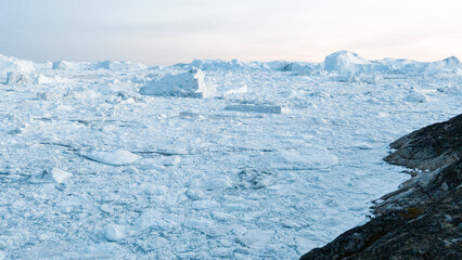 Wall Mural - global warming and climate change concept. iceberg aerial drone image of giant icebergs in disko bay