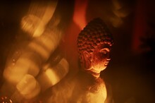 Buddha Statue Idol In A Candlelight.